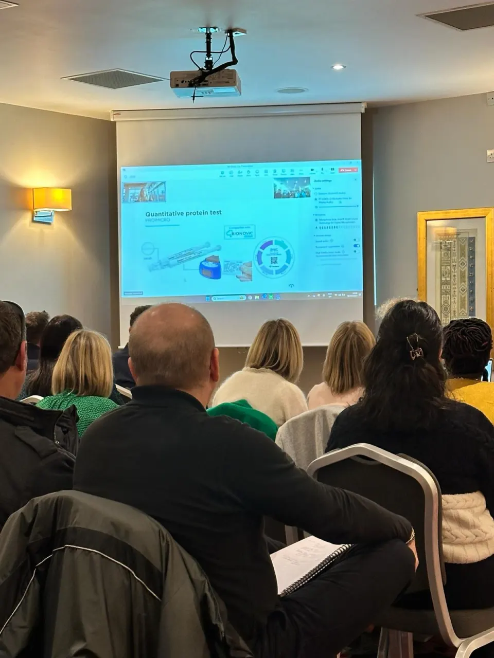 Delegates watching a presentation at an IDI Study Day.